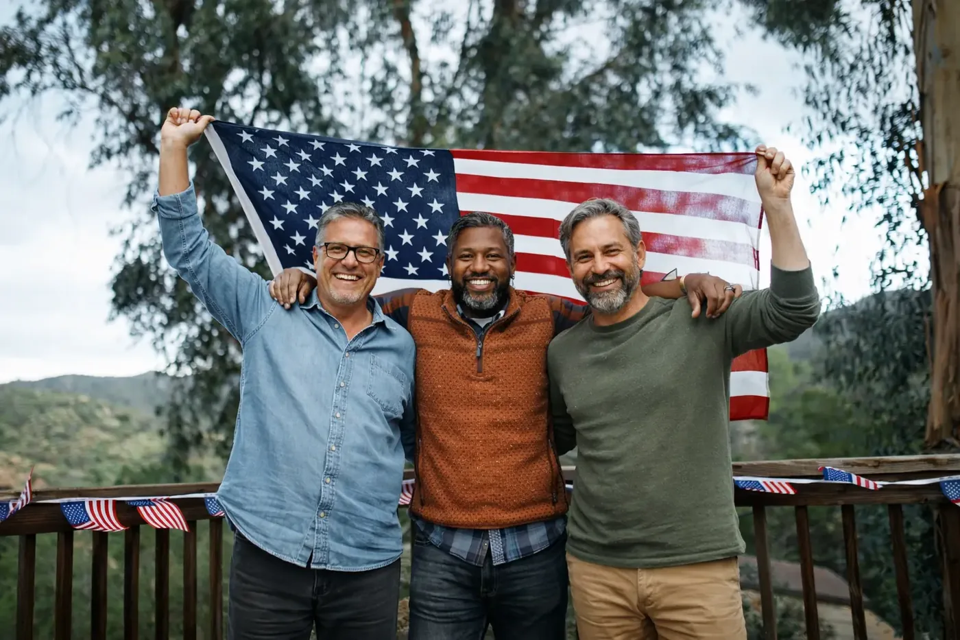 Veterans standing together beneath an American flag
